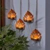Set Of 4 Hanging Gold Leaf Outdoor LED Tealights 1 Set Of 4 Hanging Gold Leaf Outdoor LED Tealights -Dunelm 30864586